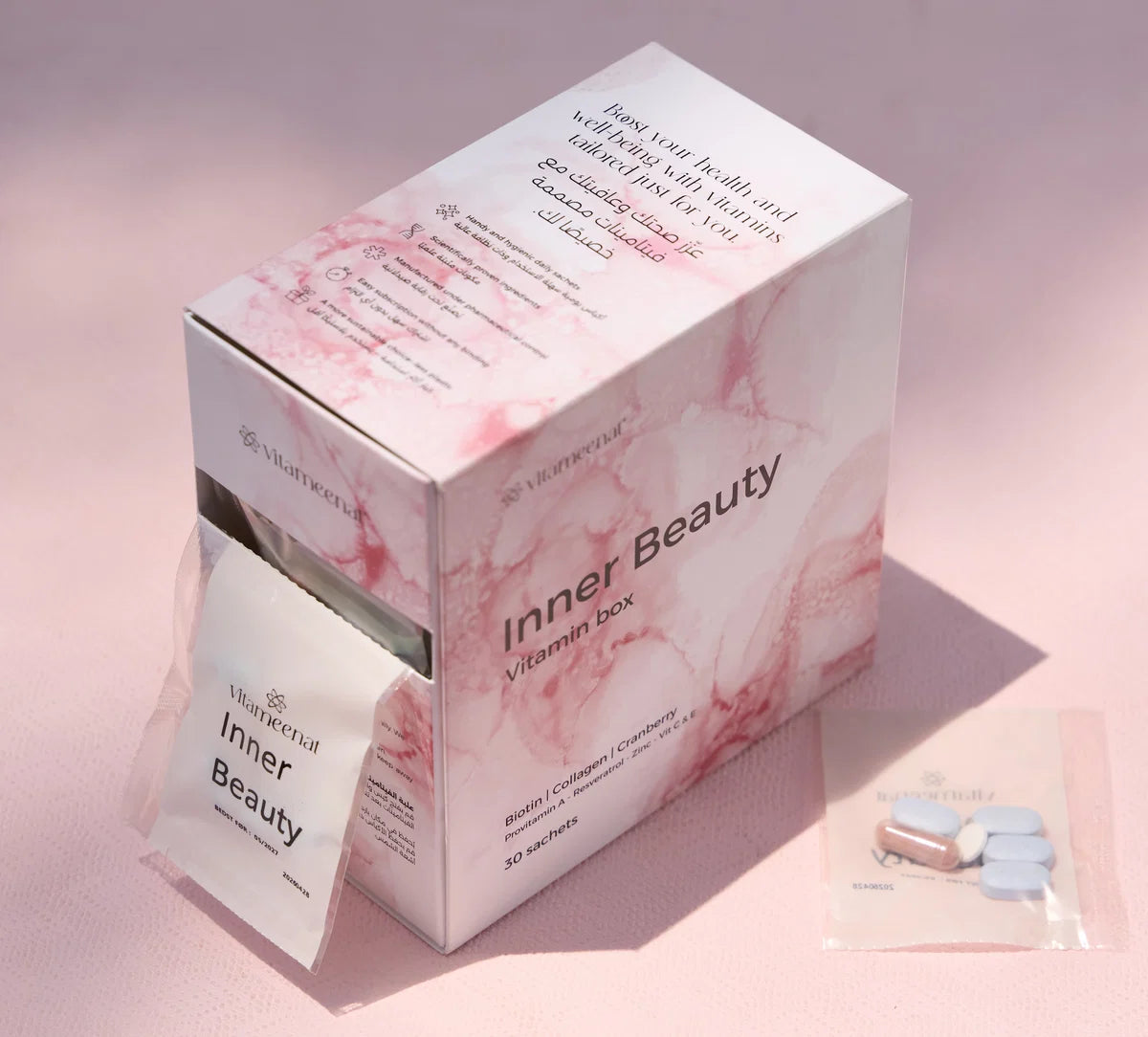 Vitamin box with 'Inner Beauty' branding on a pink background