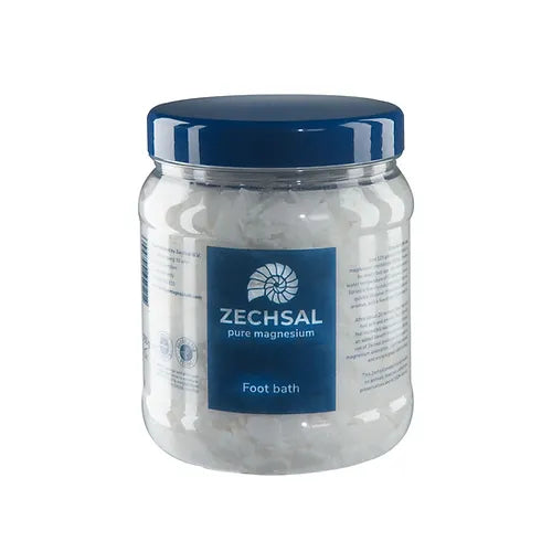 A clear plastic jar of Zechsal Pure Magnesium Foot Bath with a dark blue screw-on lid and a blue front label, shown on a plain white background.