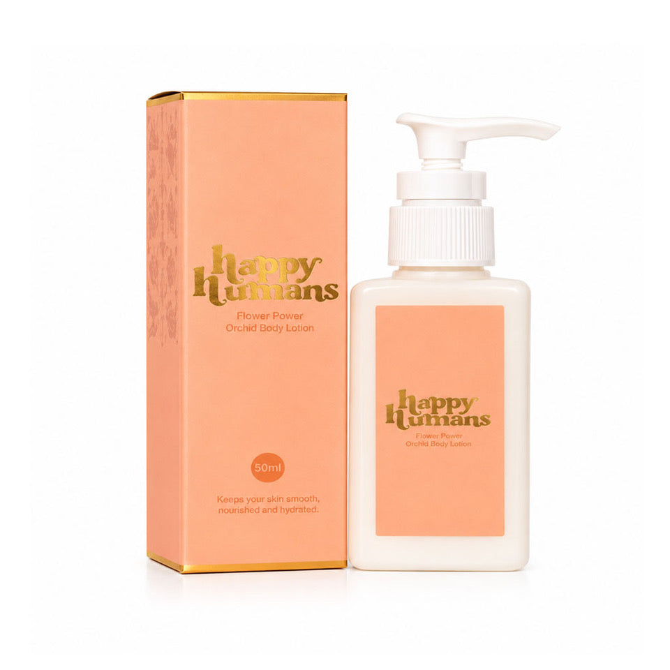 A 50ml bottle of Happy Humans Flower Power Oudiar Spice Lotion next to its peach-colored packaging box with gold lettering, set against a plain white background.