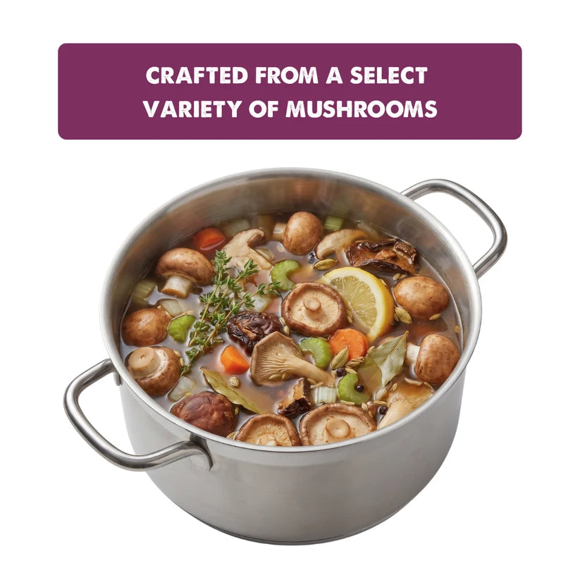 A stainless steel stockpot filled with a mushroom stew, featuring a purple text banner at the top that reads 'CRAFTED FROM A SELECT VARIETY OF MUSHROOMS'.