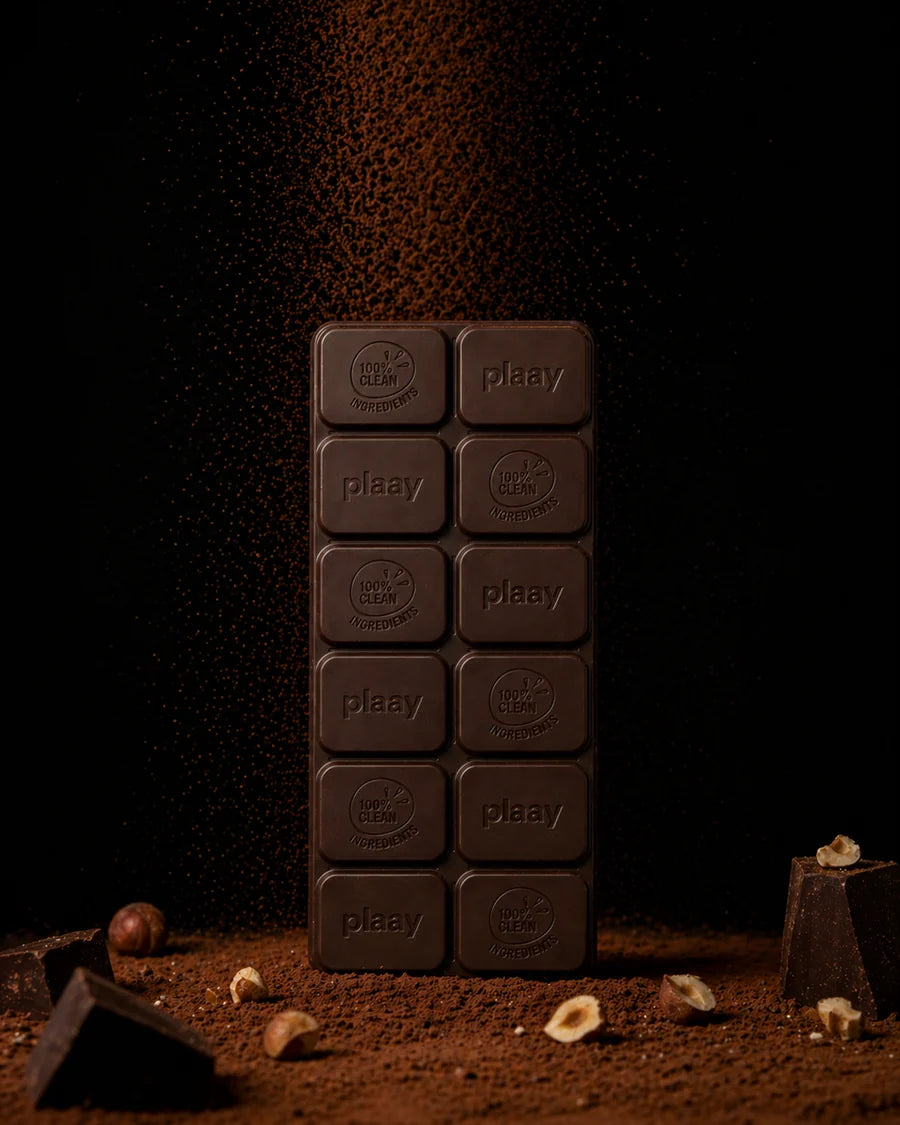 Chocolate bar with 'plaay' branding on a dark background