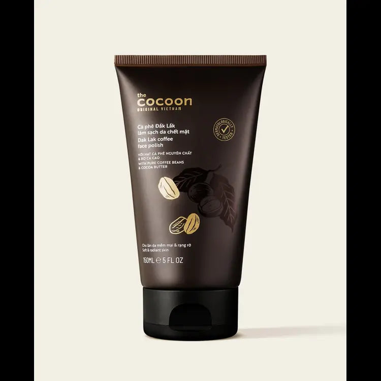 A dark brown squeeze tube of 'The Cocoon' Organic Vitamins Mont Lake coffee bean paste on a light beige background with black letterboxing on the sides.
