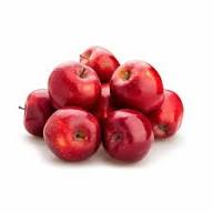 A pile of fresh red apples on a plain white background.