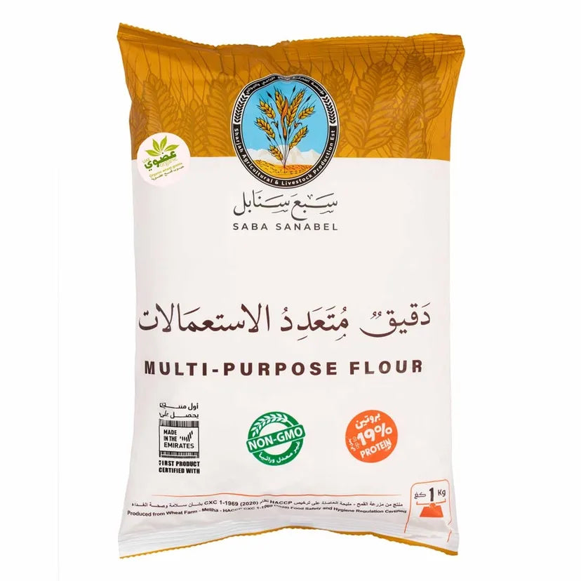 A bag of Saba Sanabel Multi-Purpose Flour, featuring a white and golden-yellow packaging design with Arabic and English text, and certification logos.