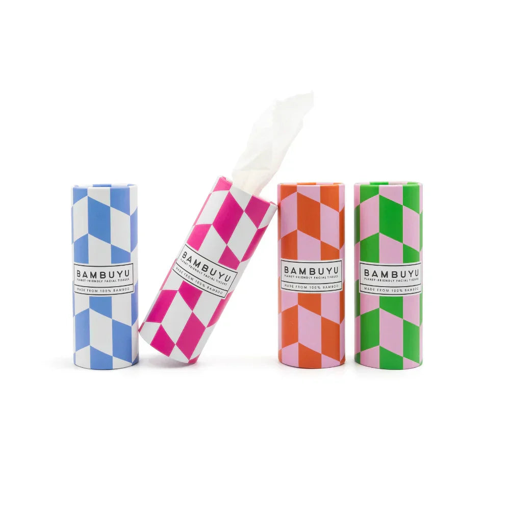 Four BambooU toilet paper rolls in colorful geometric patterned packaging, with one roll open to show the white toilet paper inside, on a clean white background.