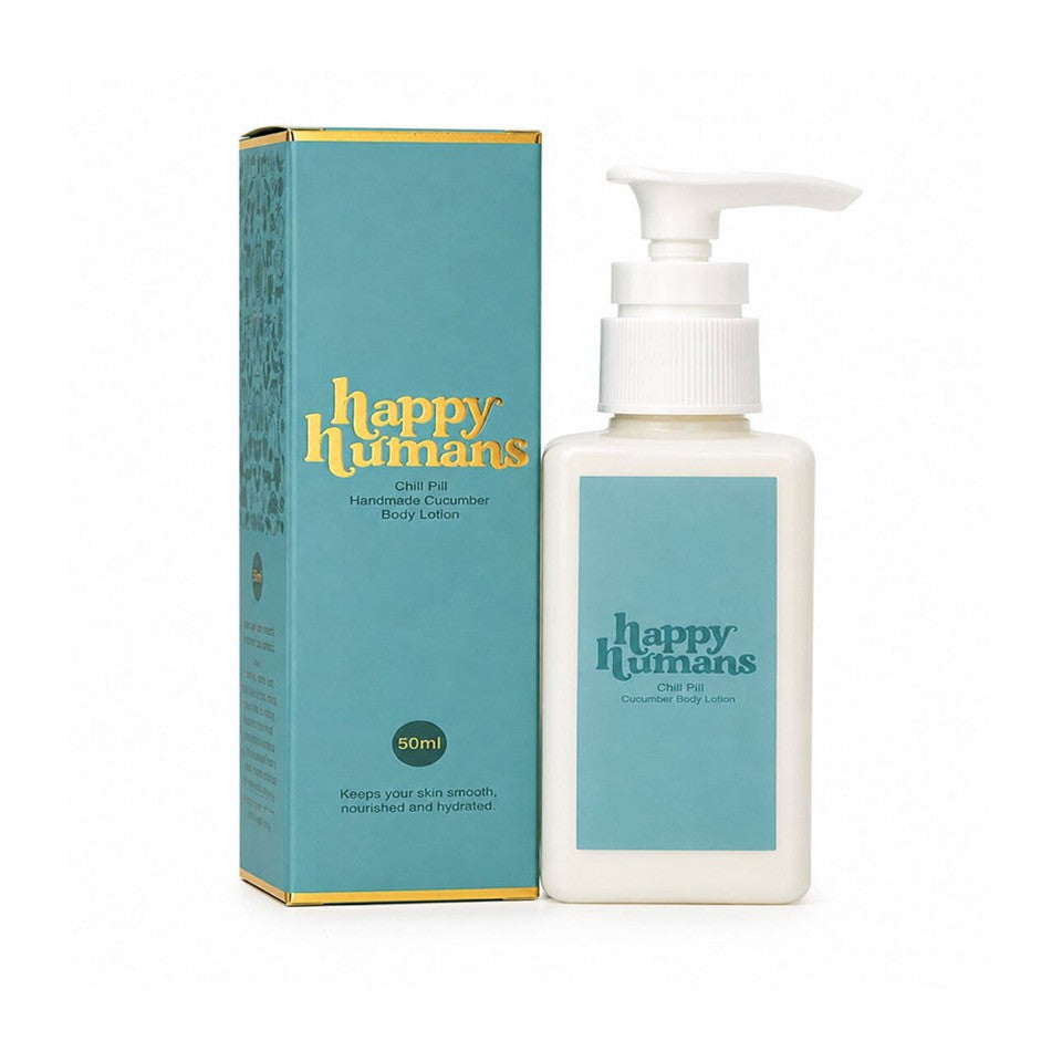 A bottle of Happy Humans Handmade Cucumber Body Lotion next to its matching teal and gold packaging box, set against a plain white background.