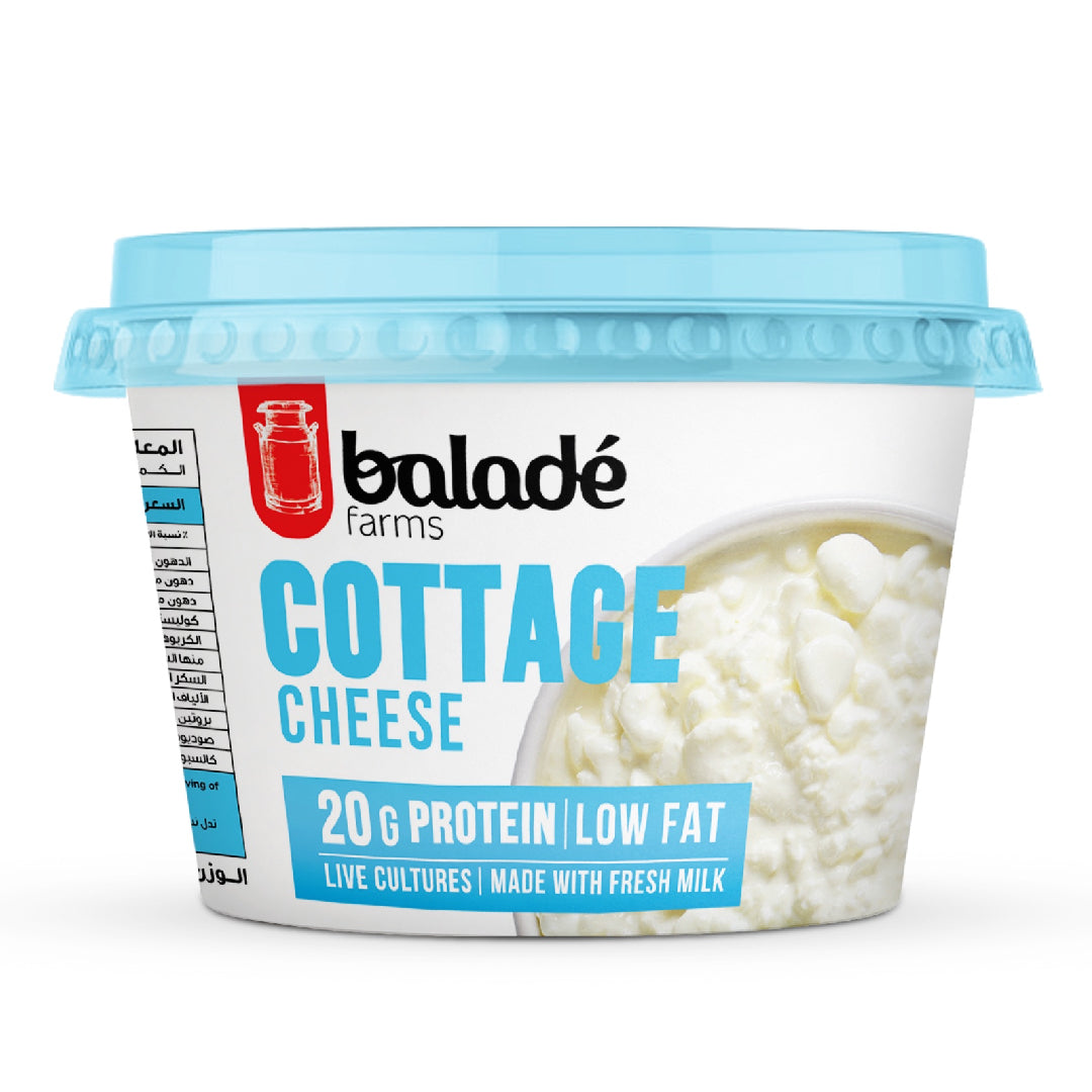 A tub of Baladé Farms Cottage Cheese with a light blue lid and white label, featuring a photo of cottage cheese on the front, set against a plain white background.