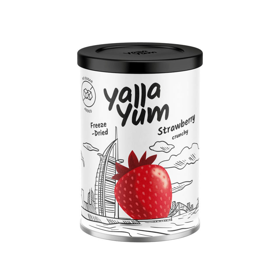 A cylindrical canister of Yalla Yum Strawberry Crunchy freeze-dried snacks, featuring a white label with a red strawberry illustration and black text, topped with a black lid.