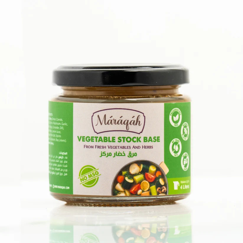 A 4-liter glass jar of Marqiáh Vegetable Stock Base with a black lid and a green and white label, set against a clean white background with a soft reflection.