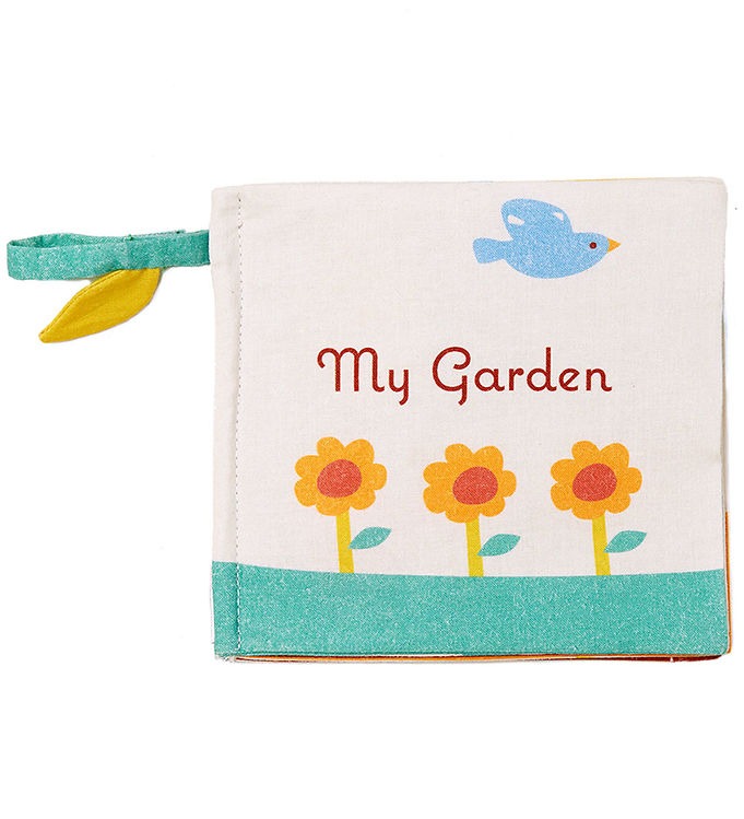 A baby soft fabric book titled 'My Garden' featuring a light pink cover with a blue bird, three yellow flowers, and a teal textured border, complete with a teal and yellow fabric loop on the left side.