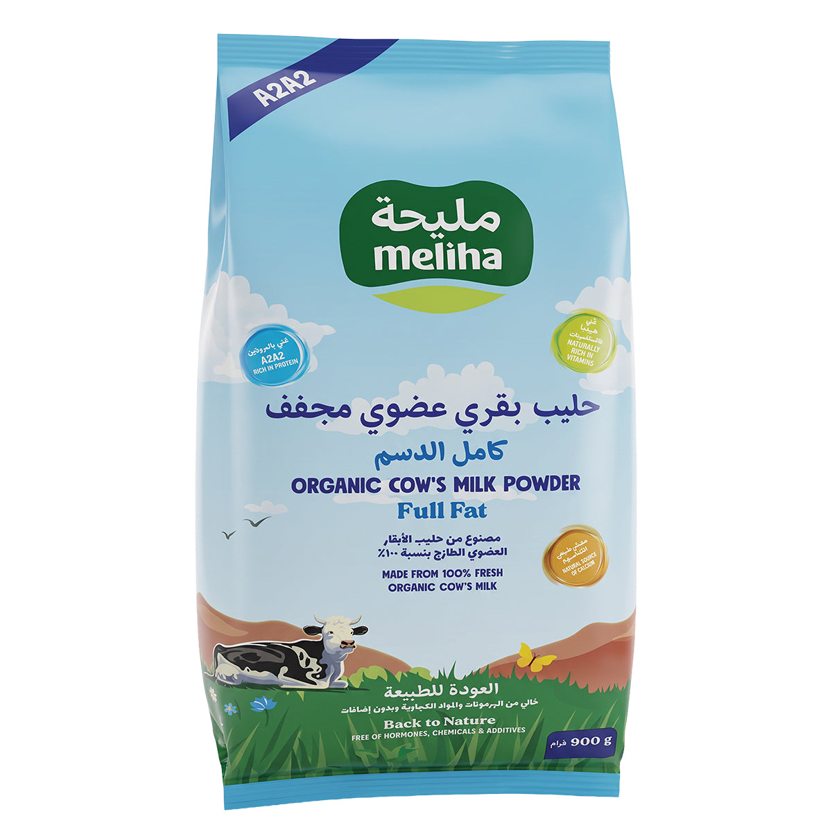 A 900g bag of Meliha Organic Cow's Milk Powder (Full Fat) on a plain white background. The packaging features a light blue sky design with a green Meliha logo, a cartoon cow, and a green grassy field at the bottom.