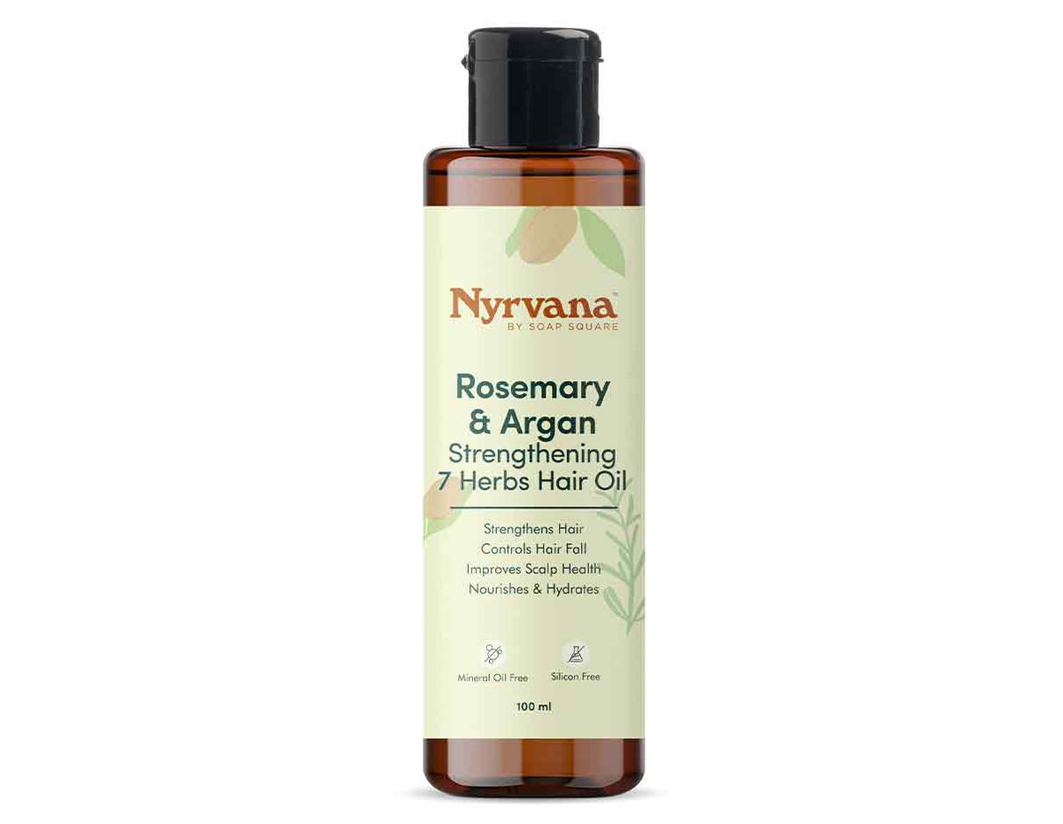 A 160 ml bottle of Nyrvana Rosemary & Argan Strengthening 7 Herbs Hair Oil, featuring an amber brown bottle, a black cap, and a cream-colored label with green and orange text.