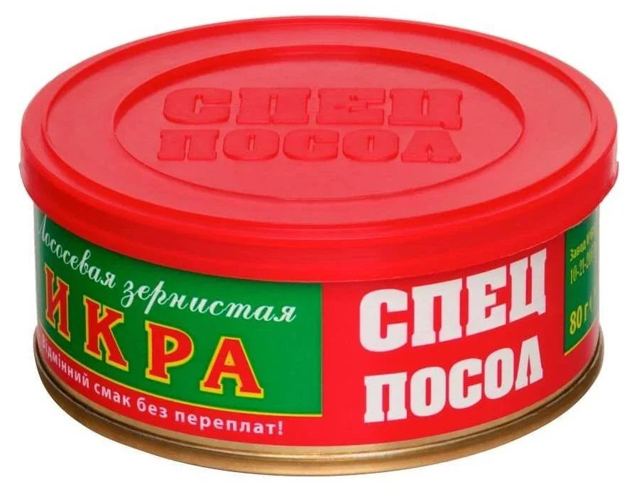 A round tin of Russian specialty salt, 'Sпец Посол' (Sпец. Salt), featuring a bright red lid and label with green and white sections and red lettering.