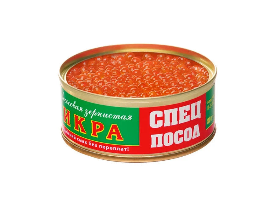 A round tin of Russian caviar with a green and red label featuring white and yellow text, filled with orange-red caviar, isolated on a white background.